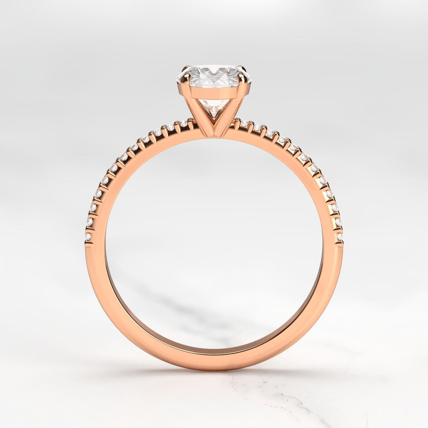 Oval half pave tapered diamond ring