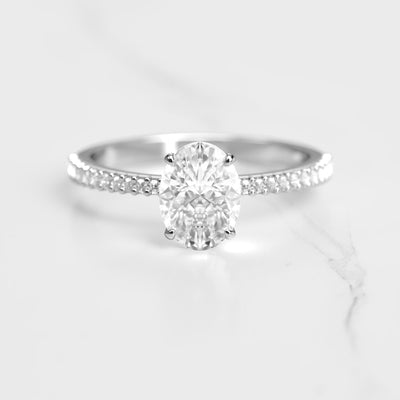 Oval half pave tapered moissanite ring