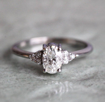 Oval Moissanite Ring With White Side Diamonds-Capucinne