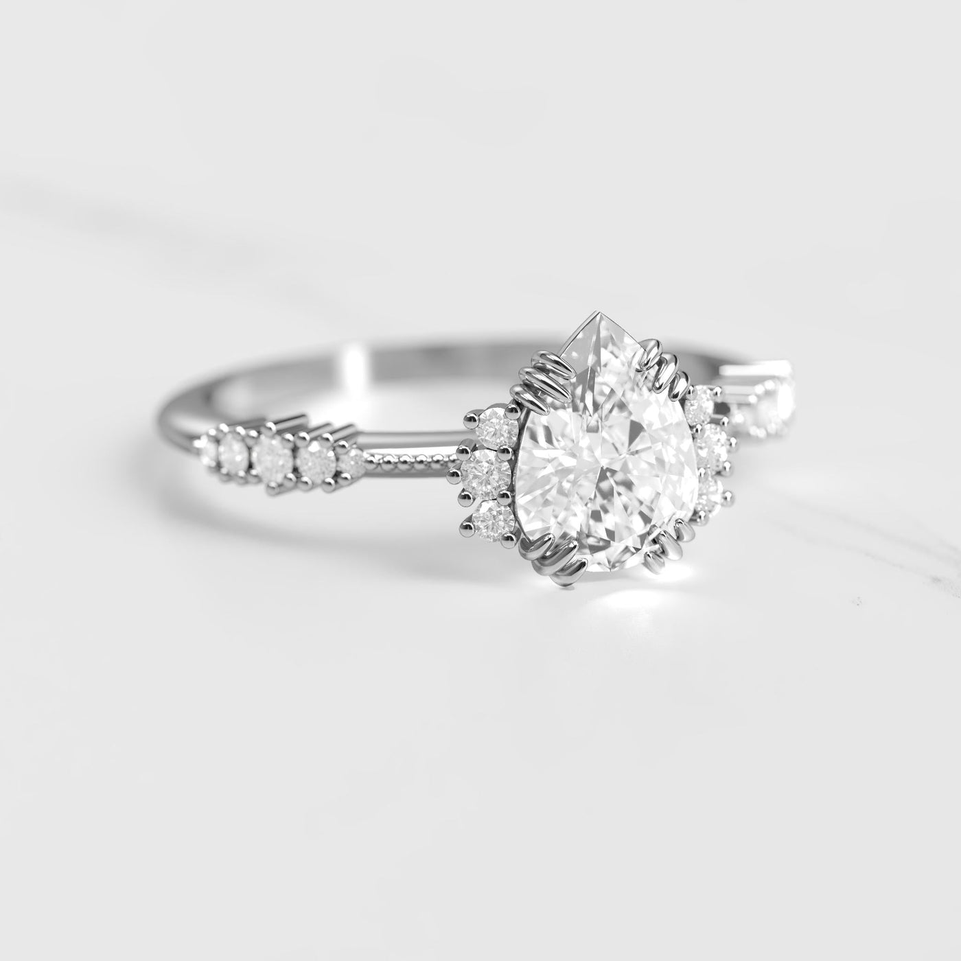Pear-shaped white natural diamond cluster ring