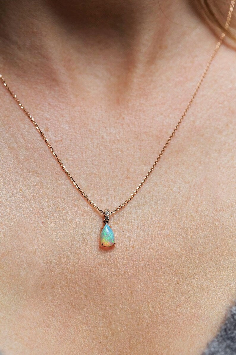 Green-blue pear-shaped opal gold necklace with diamond pave