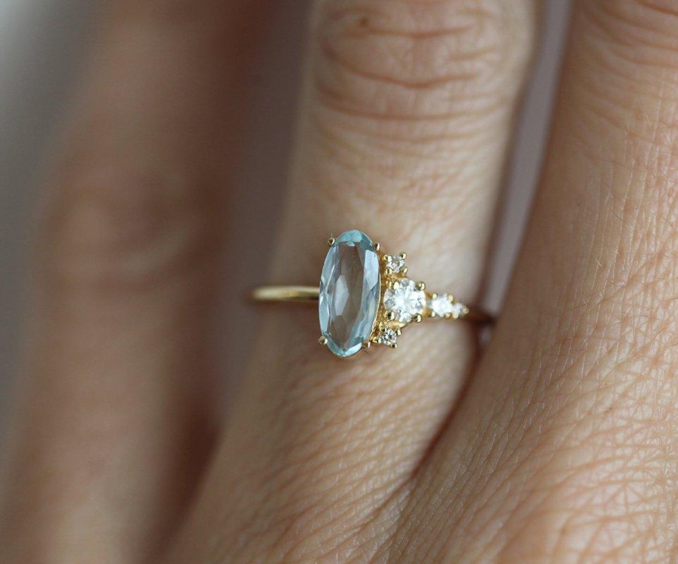 Oval Aquamarine Yellow Gold Ring with Asymmetrical Side Cluster Diamonds