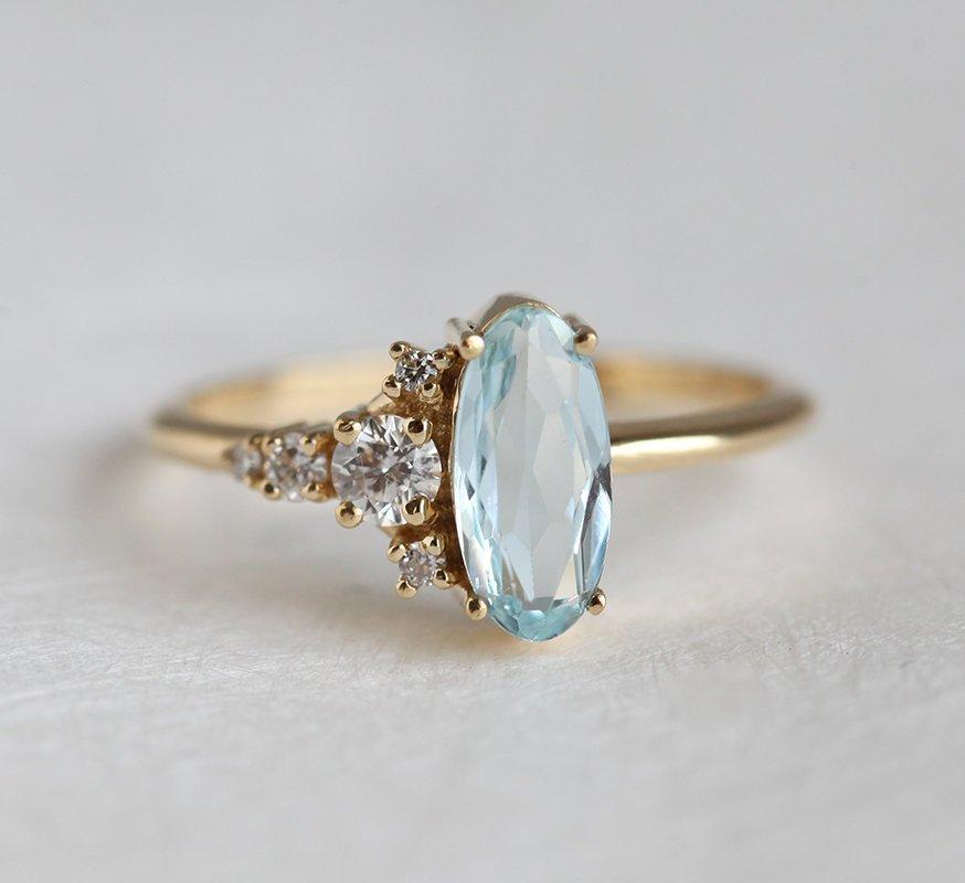 Oval Aquamarine Yellow Gold Ring with Asymmetrical Side Cluster Diamonds