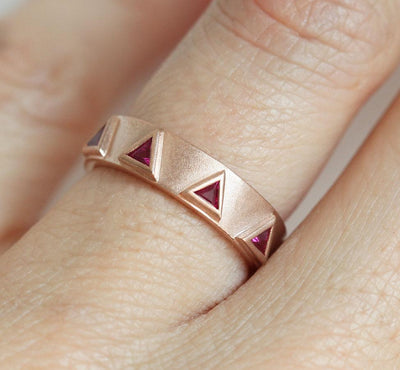 Triangle-shaped purplish red ruby half eternity ring