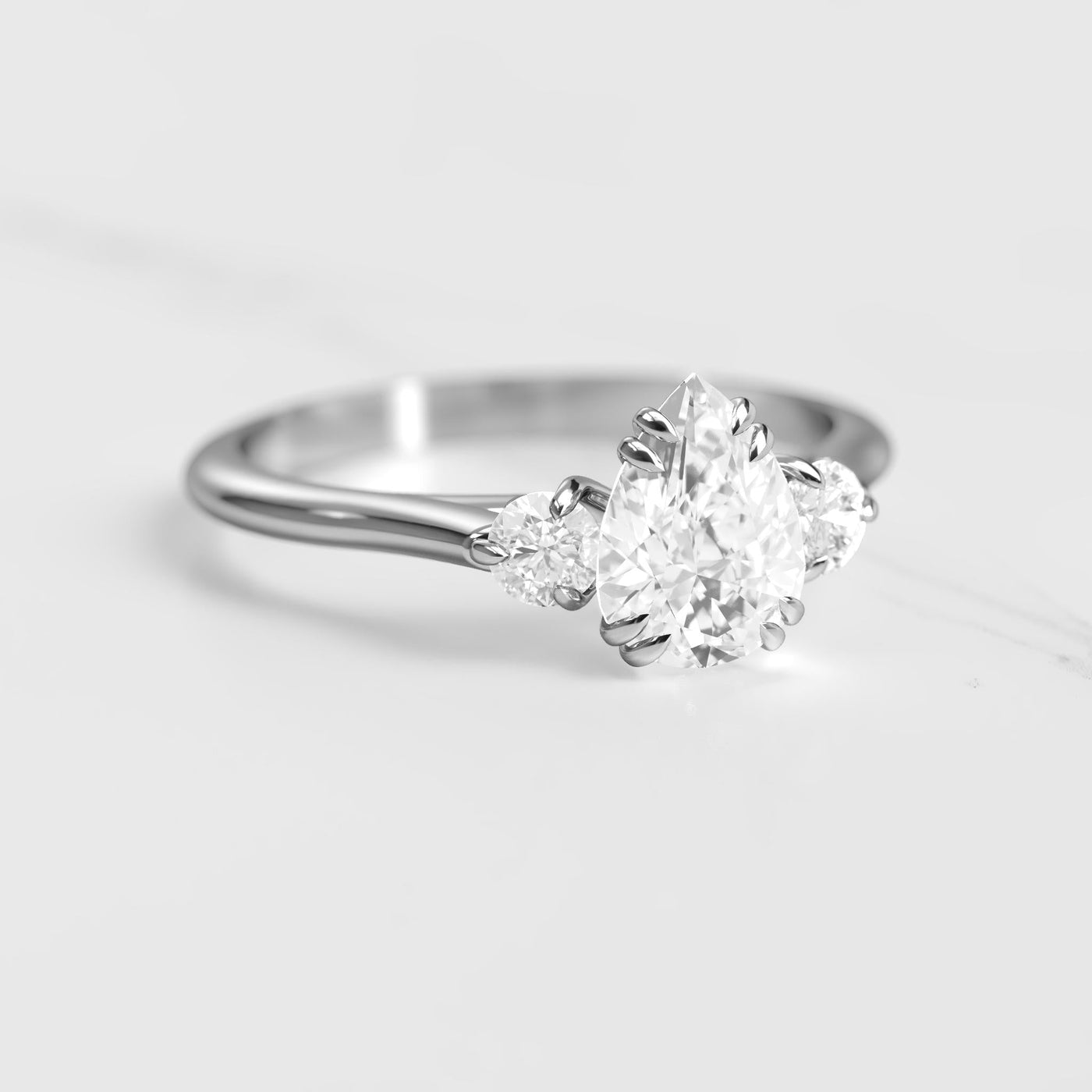 3-Stone pear-shaped white natural diamond ring