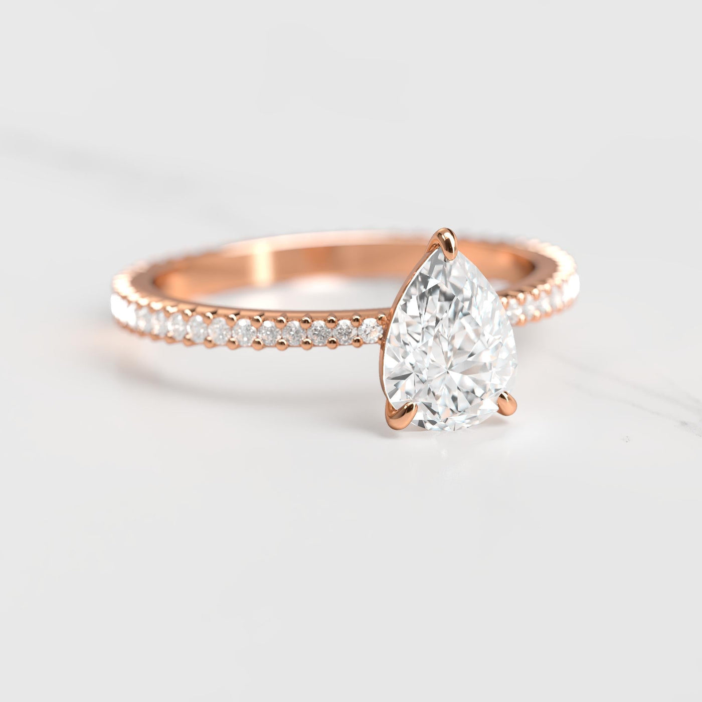 Pear-shaped full-pave tapered moissanite ring