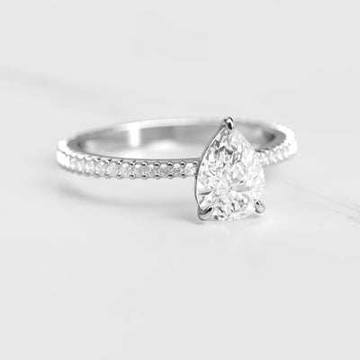 Pear-shaped full-pave tapered moissanite ring