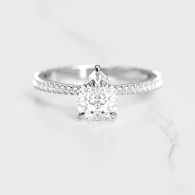 Pear-shaped full-pave tapered moissanite ring