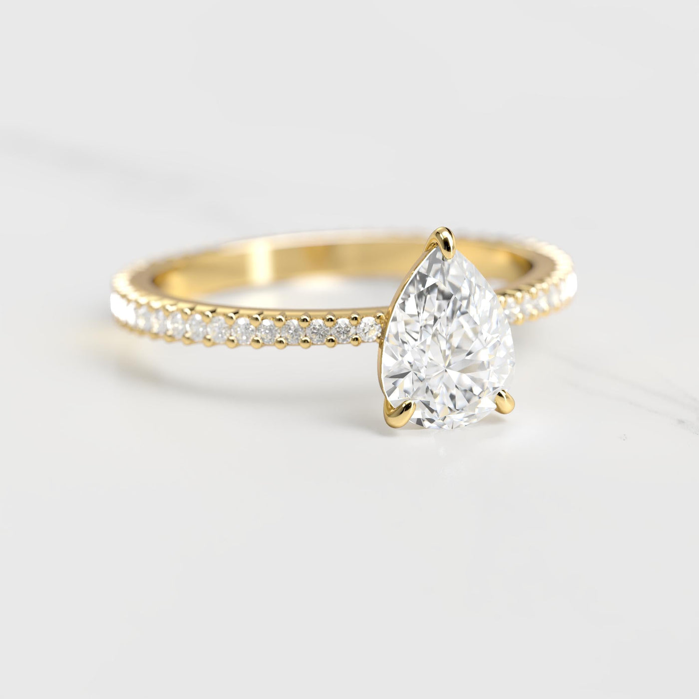 Pear-shaped full-pave tapered moissanite ring