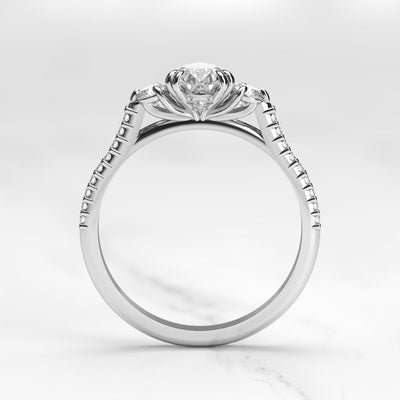 Pear-shaped half pave diamond ring with accent stones