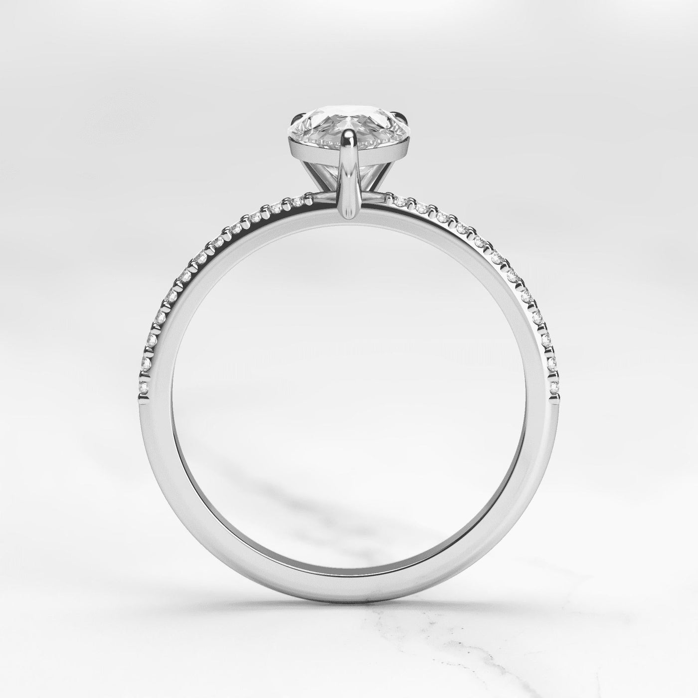 Pear-shaped half pave moissanite ring