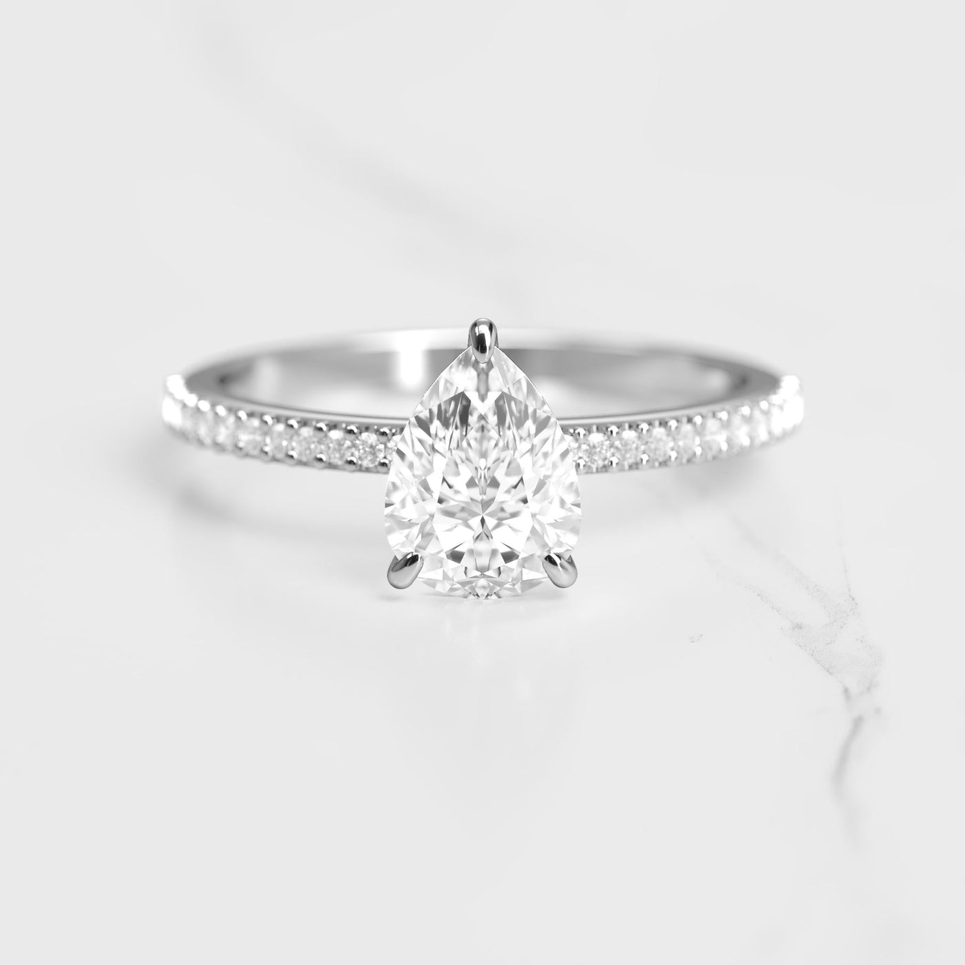 Pear-shaped half pave moissanite ring