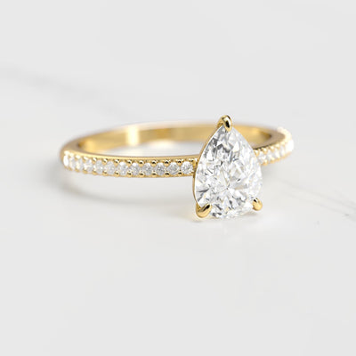 Pear-shaped half pave moissanite ring