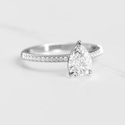 Pear-shaped half pave moissanite ring