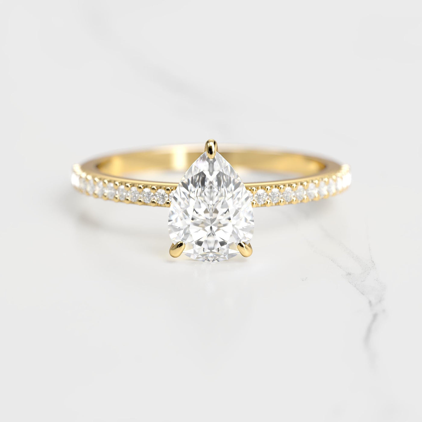 Pear-shaped half pave moissanite ring