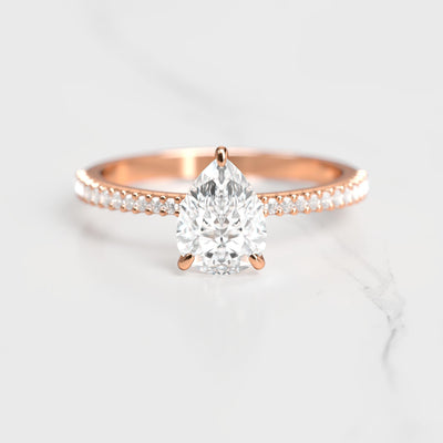 Pear-shaped half pave tapered diamond ring