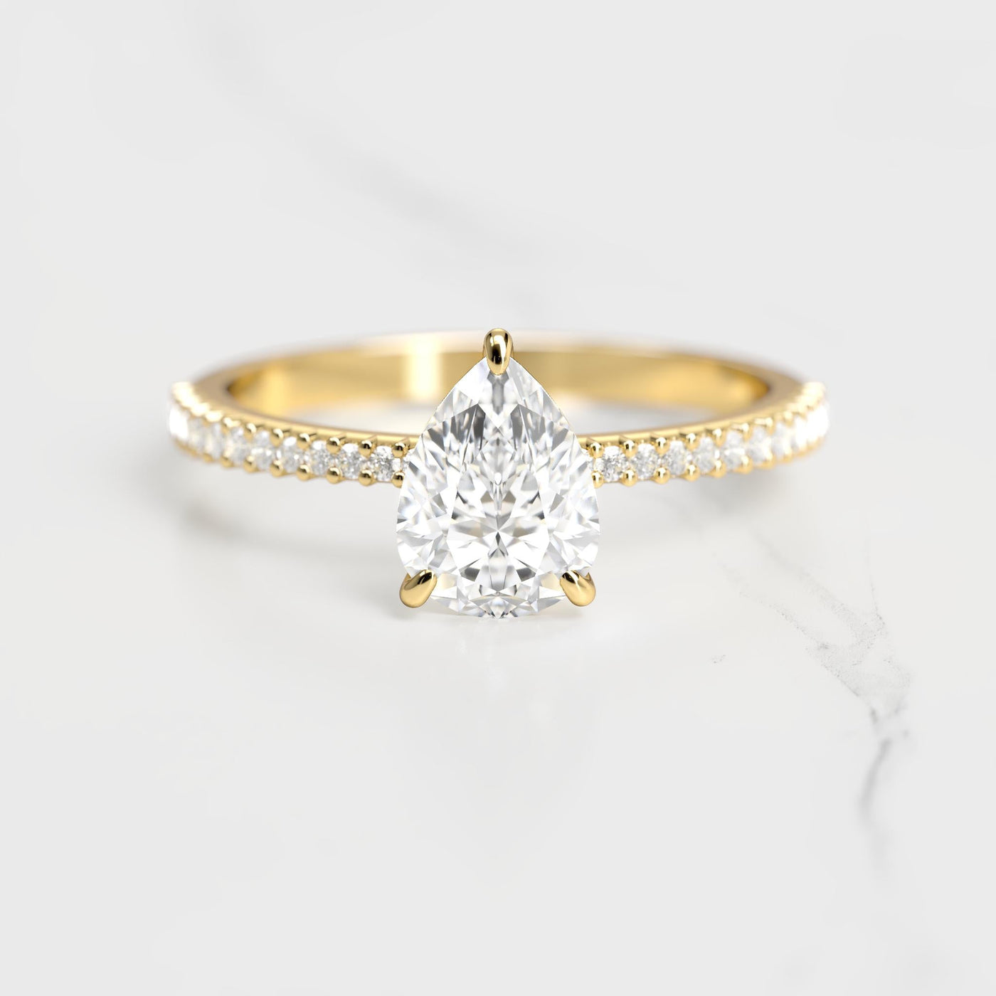 Pear-shaped half pave tapered moissanite ring