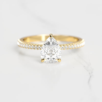 Pear-shaped half pave tapered moissanite ring