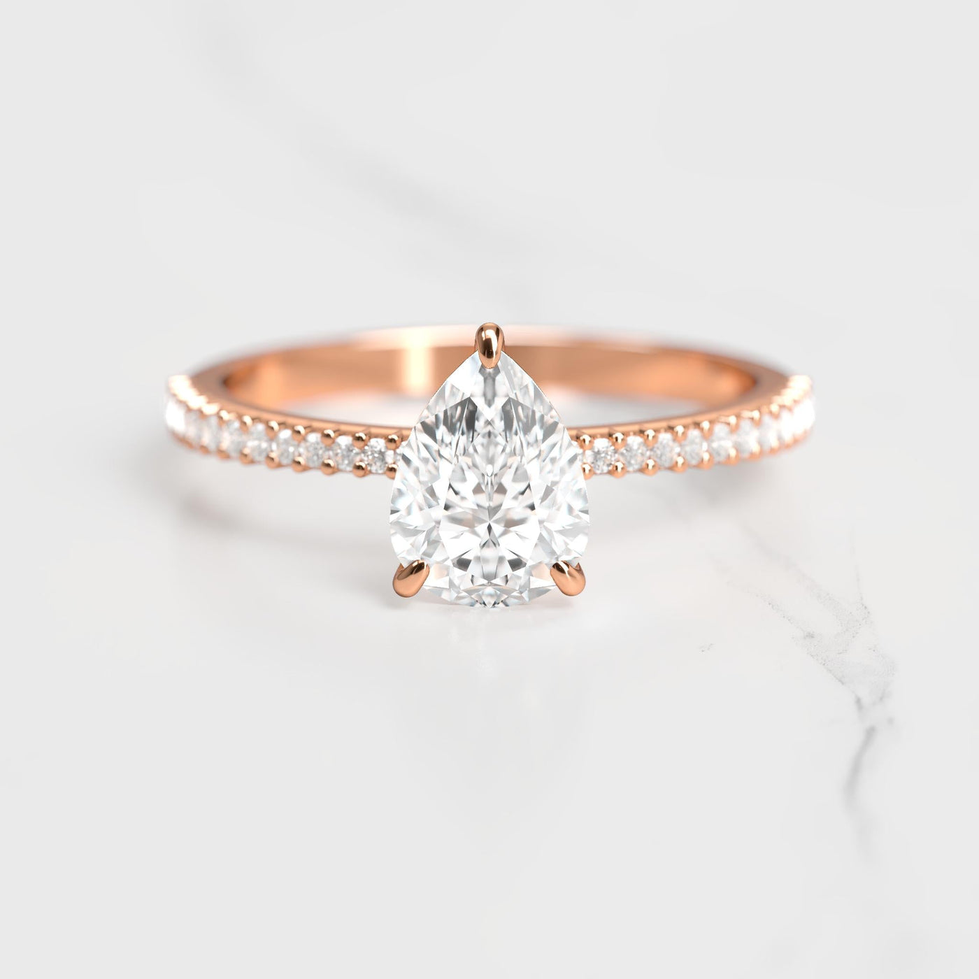 Pear-shaped half pave tapered moissanite ring