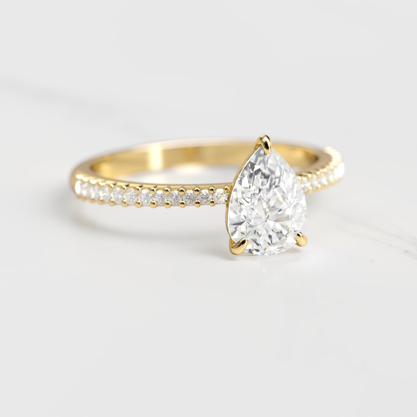 Pear-shaped half pave tapered moissanite ring