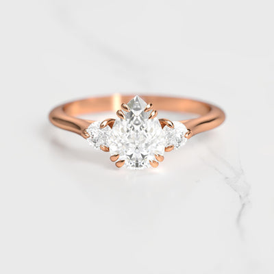 3-Stone pear-shaped white moissanite ring