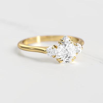 3-Stone pear-shaped white moissanite ring