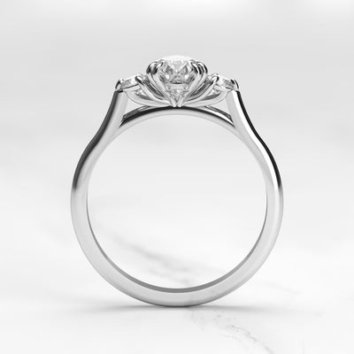 3-Stone pear-shaped white moissanite ring