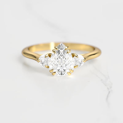 3-Stone pear-shaped white moissanite ring