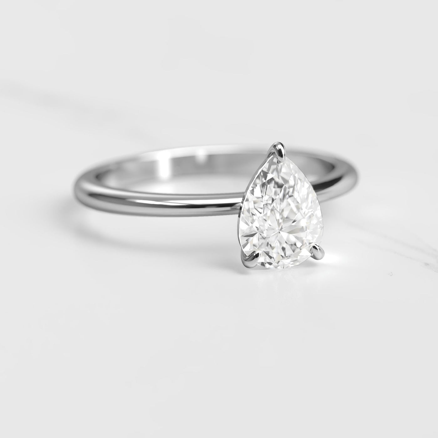 Pear-shaped tapered solitaire moissanite ring