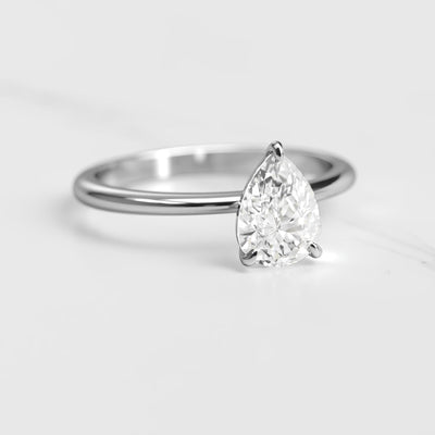 Pear-shaped tapered solitaire moissanite ring