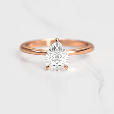 Pear-shaped tapered solitaire moissanite ring