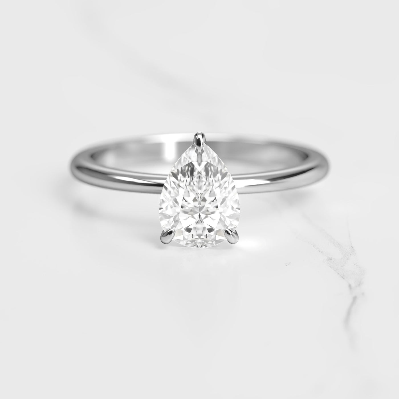 Pear-shaped tapered solitaire moissanite ring