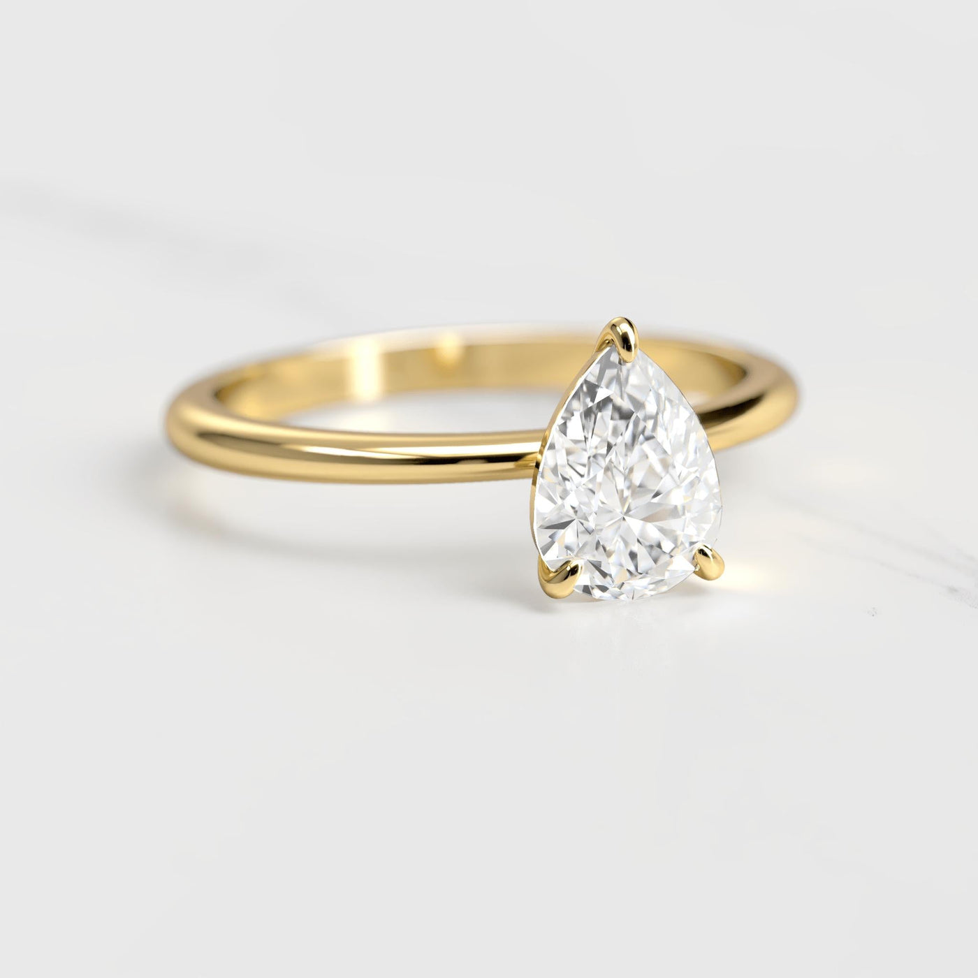 Pear-shaped tapered solitaire moissanite ring