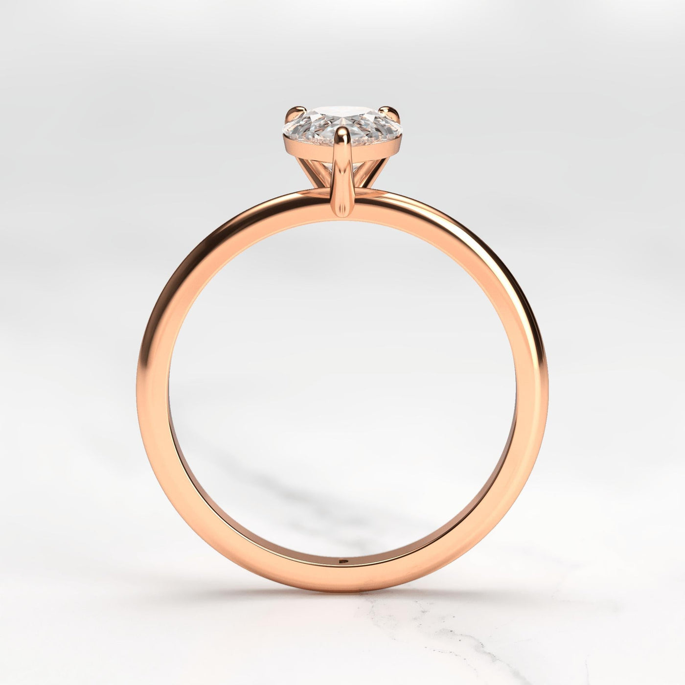 Pear-shaped tapered solitaire diamond ring