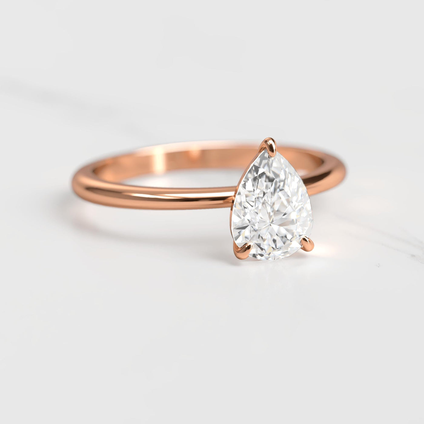 Pear-shaped tapered solitaire diamond ring