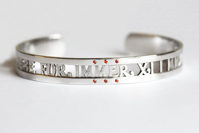 Solid gold cuffed bracelet with personalized message