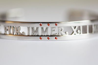 Solid gold cuffed bracelet with personalized message