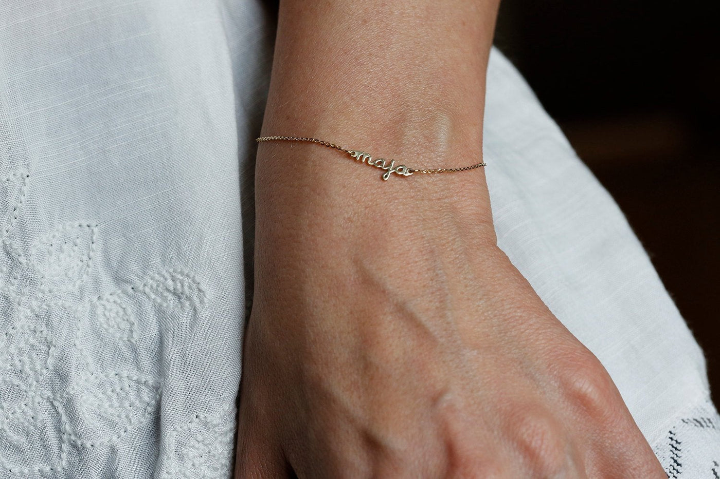 Gold chain bracelet with personalized name and birthstone