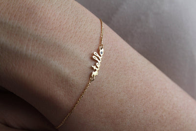Gold chain bracelet with personalized name and birthstone