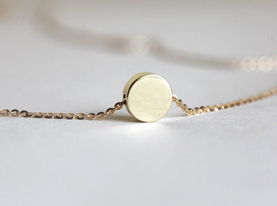 Gold chain necklace with gold disc