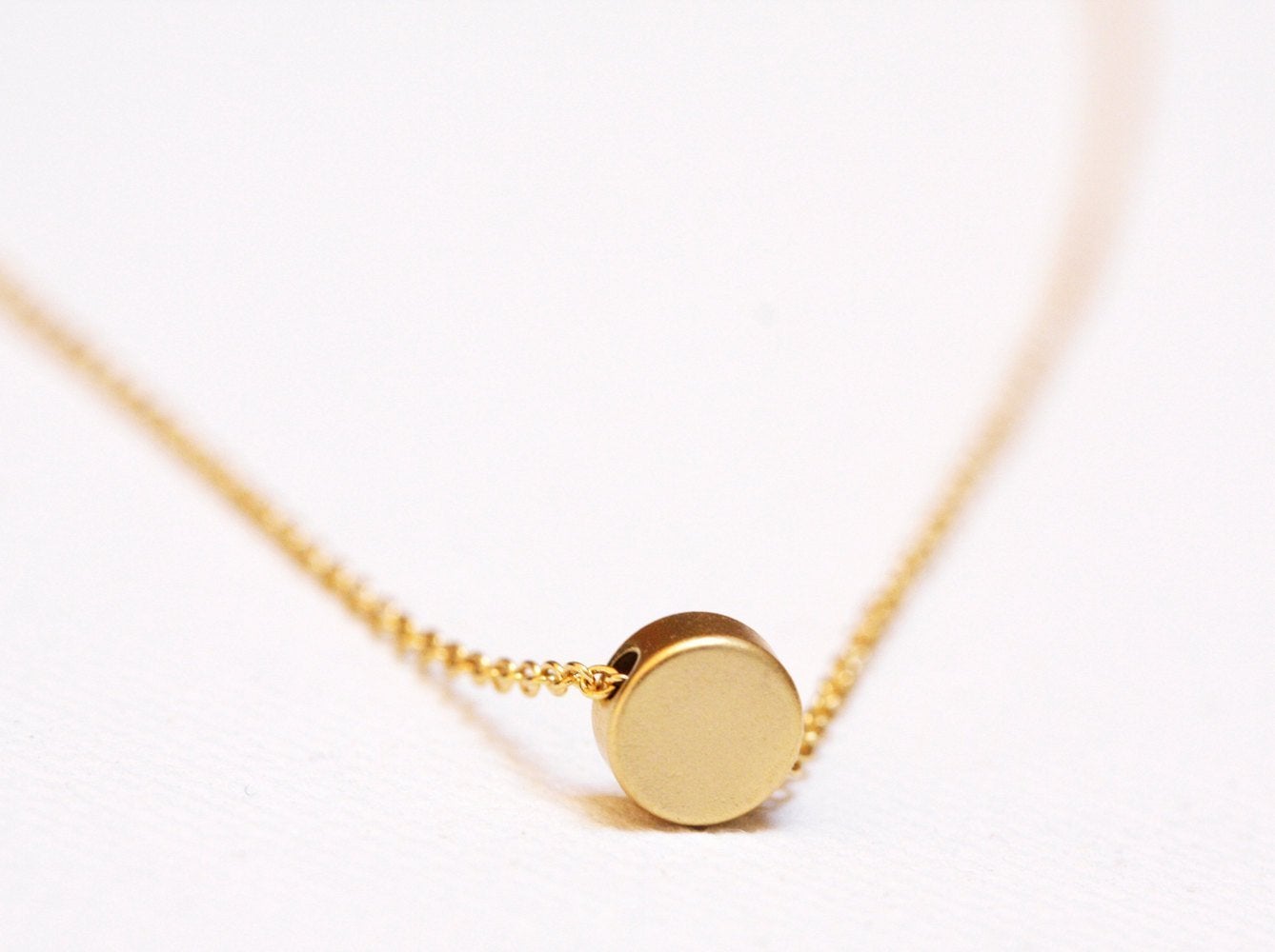 Gold chain necklace with gold disc