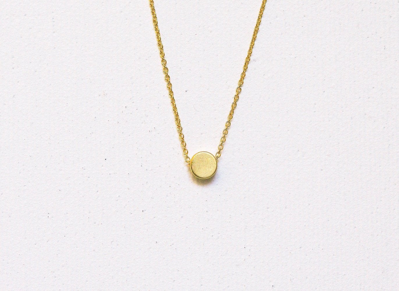 Gold chain necklace with gold disc