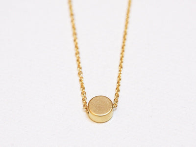 Gold chain necklace with gold disc