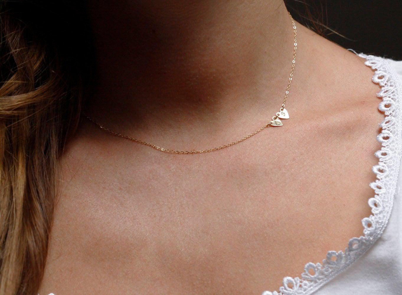 Gold necklace with gold hearts and personalized sideways initials