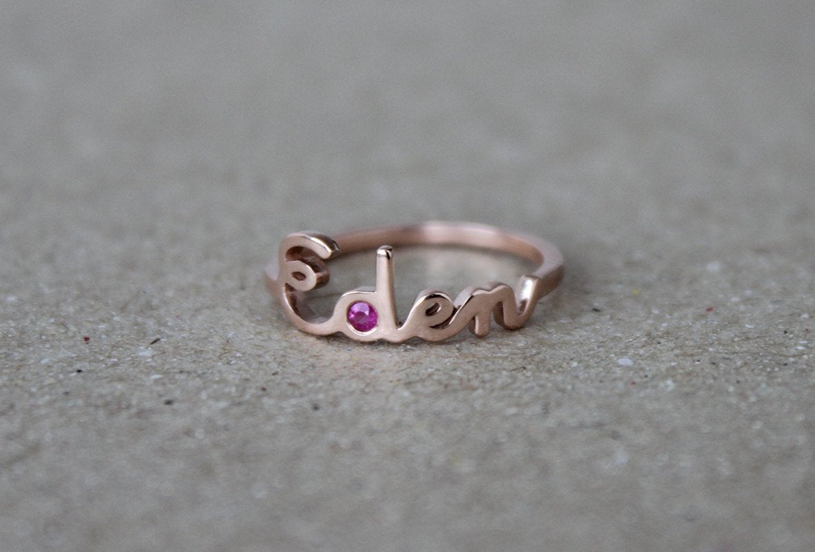 Personalized name gold ring with round red ruby