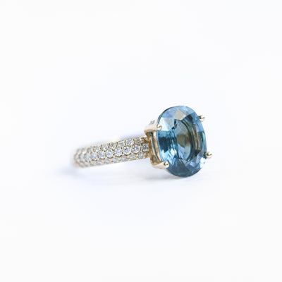 Oval-shaped blue sapphire ring with diamonds
