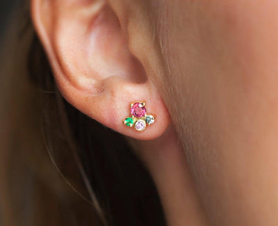 Round pink sapphire stud earrings with emeralds