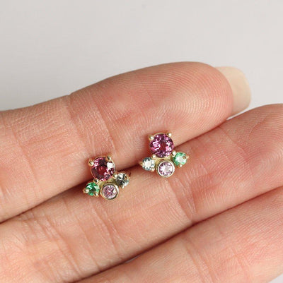 Round pink sapphire stud earrings with emeralds