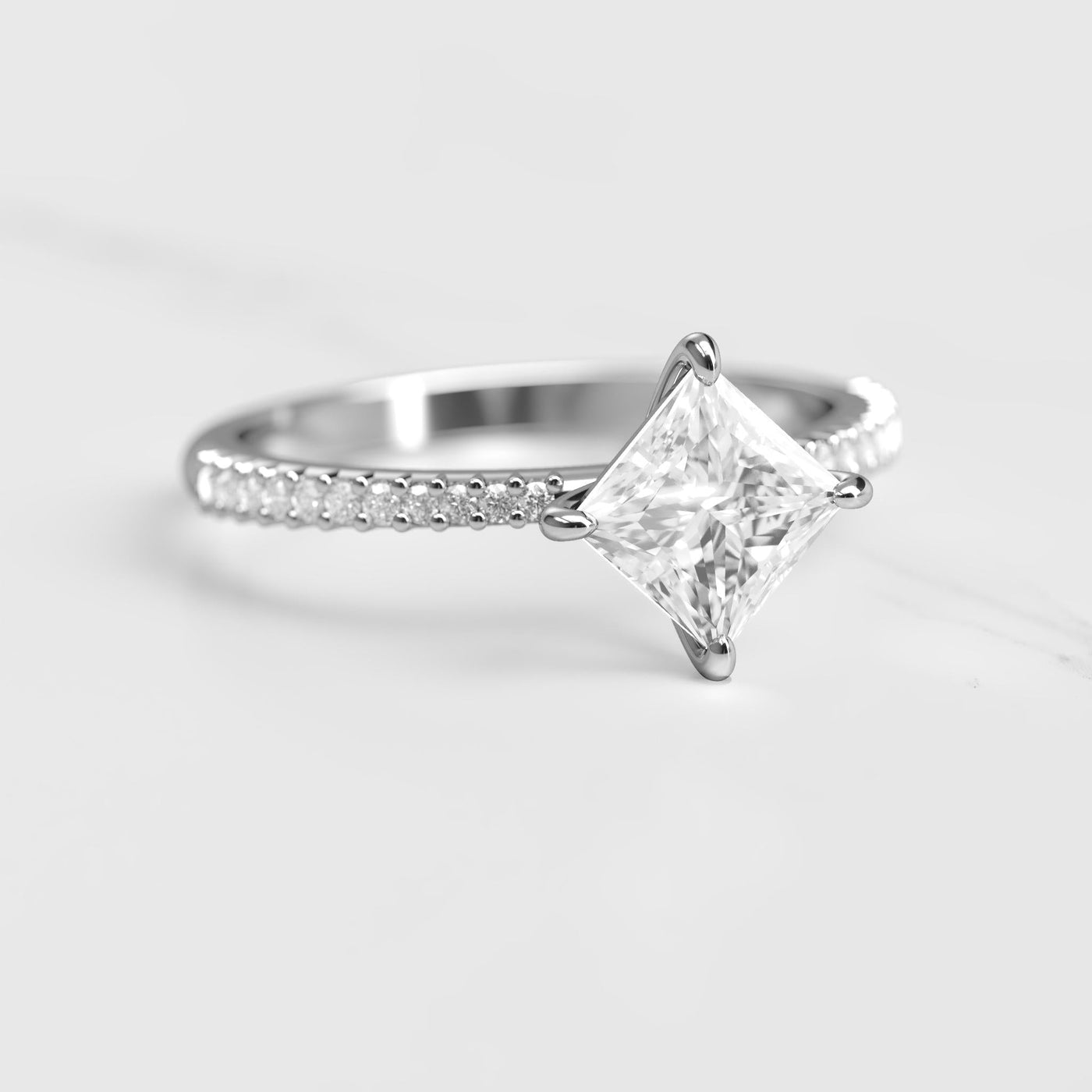 Princess-cut half pave tapered moissanite ring