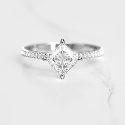 Princess-cut half pave tapered moissanite ring